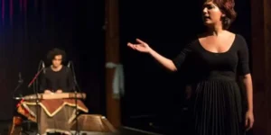 Solo lament in “Siavoshan”: the lead sings with an outstretched hand as the santur accompanist sits behind.